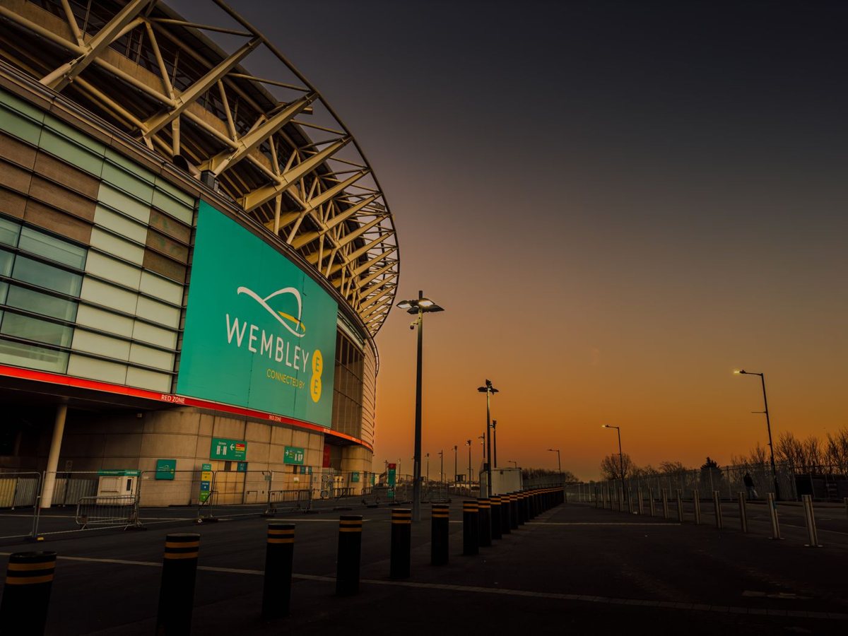 Wembley Stadium in London at dawn, where an early NFL game can be decided before fantasy players in the U.S. wake up